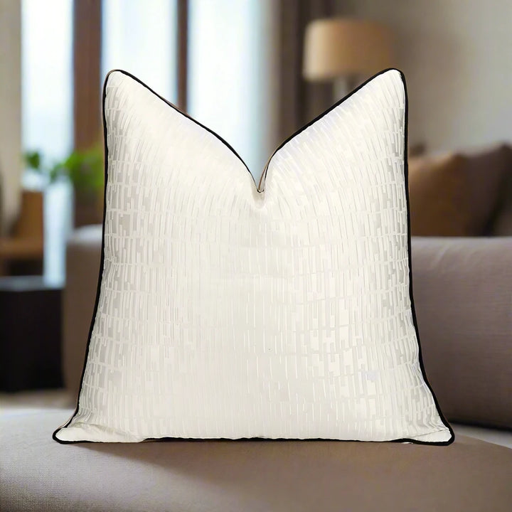 White Embossed Geometric Satin Black Contrast Pipe Cushion