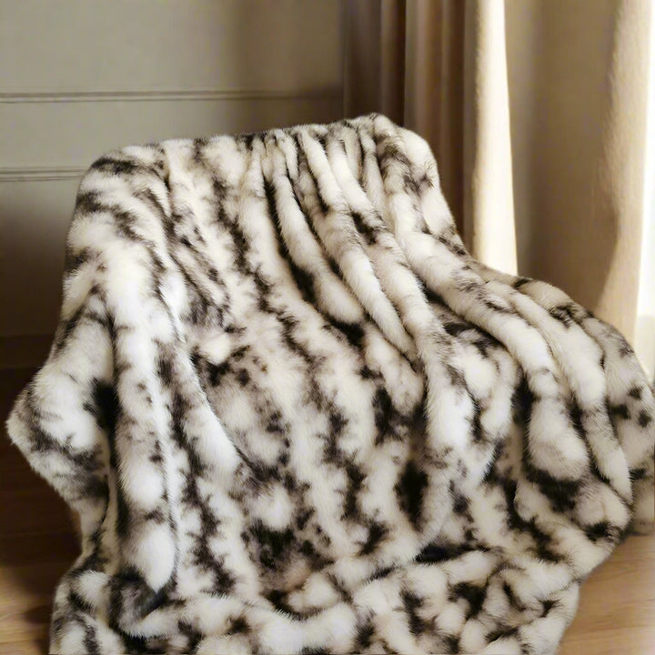 cream brown mix faux fur throw details on leather sofa